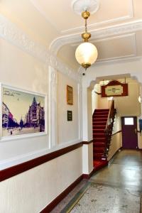 a hallway of a building with a painting on the wall at Apartments im Thüringer Hof in Berlin