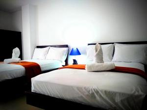 Postel nebo postele na pokoji v ubytování Hotel Casimena