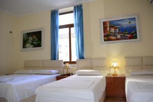 Postel nebo postele na pokoji v ubytování Hotel Republika