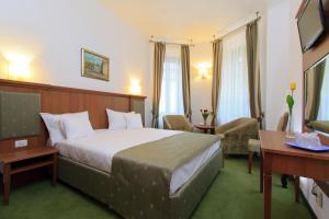 Postel nebo postele na pokoji v ubytování Hotel Palace