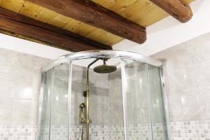a shower with a glass door in a bathroom at Apartments D&N in Vis +51 photos