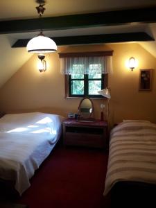 Ένα ή περισσότερα κρεβάτια σε δωμάτιο στο Siedlisko LILIJKA