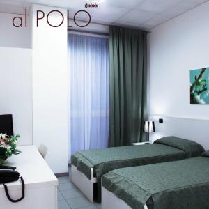 מיטה או מיטות בחדר ב-hotel IL POLO