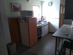 Kuchyň nebo kuchyňský kout v ubytování Apartmany Pohořaly