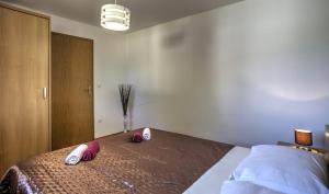 Postel nebo postele na pokoji v ubytování Apartment Ena 1