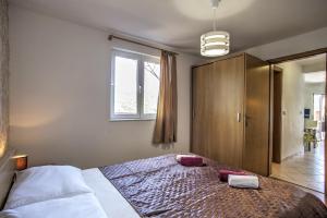 Postel nebo postele na pokoji v ubytování Apartment Ena 1