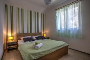 Postel nebo postele na pokoji v ubytování Apartment Ena 2