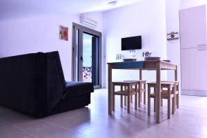 a living room with a table and a couch at Apartments Svijet Mora in Povljana