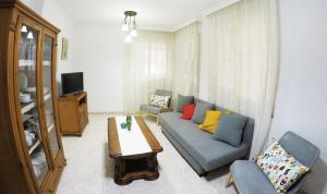 a living room with a couch and a table at Apartamento EuroRental con WiFi in Santa Cruz de Tenerife