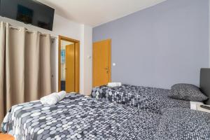 Postel nebo postele na pokoji v ubytování Apartment Anton, Fazana