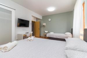 Postel nebo postele na pokoji v ubytování Apartment Anton, Fazana