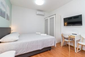 Postel nebo postele na pokoji v ubytování Apartment Anton, Fazana