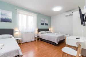 Postel nebo postele na pokoji v ubytování Apartment Anton, Fazana