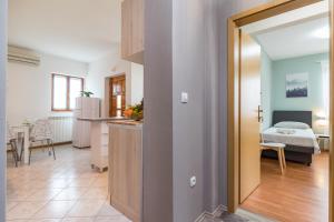 Postel nebo postele na pokoji v ubytování Apartment Anton, Fazana