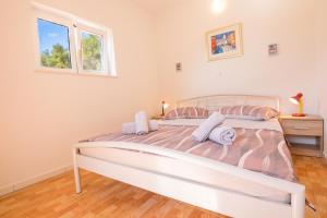 Postel nebo postele na pokoji v ubytování Apartman Pharia