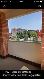 a large window with a view of a city at Leo e Patty Appartamento A Bologna09 in Bologna