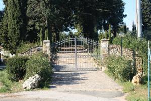 a gate in a park with a fence at Donzellino in Massa Marittima