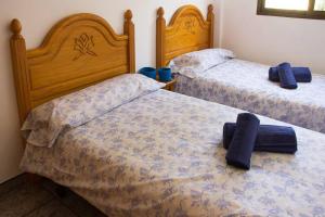 Postel nebo postele na pokoji v ubytování APARTAMENTO LOS NARCISOS