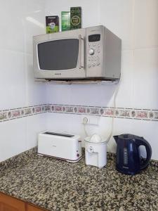 Kuchyň nebo kuchyňský kout v ubytování APARTAMENTO LOS NARCISOS