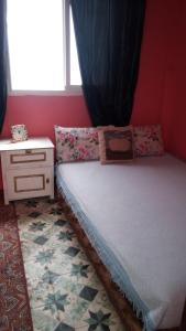 Säng eller sängar i ett rum på Dar Al Taaj