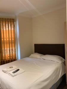 Ένα ή περισσότερα κρεβάτια σε δωμάτιο στο City Lodge London
