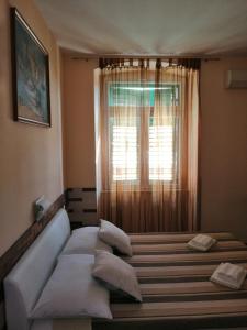Posteľ alebo postele v izbe v ubytovaní Split Center Apartment