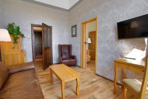 Televízia a/alebo spoločenská miestnosť v ubytovaní Hotel Štekl - Hrubá Skála