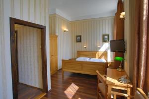 Posteľ alebo postele v izbe v ubytovaní Hotel Štekl - Hrubá Skála
