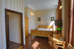 Postel nebo postele na pokoji v ubytování Hotel Štekl - Hrubá Skála