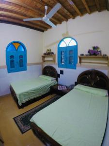 Postel nebo postele na pokoji v ubytování villa tunis village