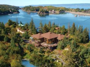 an aerial view of a large house on a lake at Stillpoint Lodge - All-Inclusive in Halibut Cove