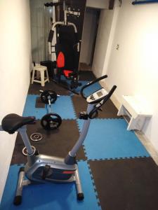 a room with a gym with two exercise bikes at Hotel Playa Brava in Punta del Este