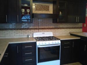 A kitchen or kitchenette at LUNA APARTMENT