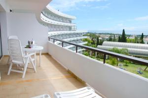 a view from a balcony of a hotel with a view of the ocean at TRH Paraíso in Estepona