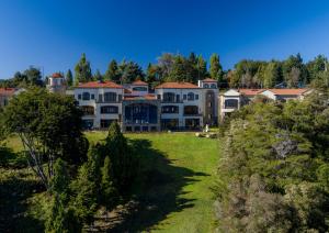 an aerial view of a large house with a yard at Villa Beluno Hotel & Spa in San Carlos de Bariloche
