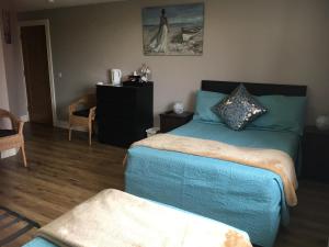 Postelja oz. postelje v sobi nastanitve O'Learys Lodge