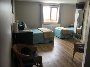 Postelja oz. postelje v sobi nastanitve O'Learys Lodge