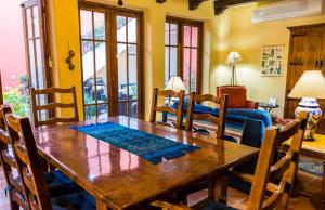 a dining room with a wooden table and chairs at Casa Vista del Mar in Loreto