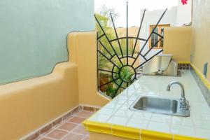 a bathroom with a sink and a window at Casa Linda in Loreto +21 photos