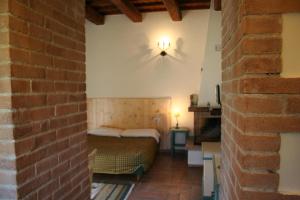 A bed or beds in a room at Borgo Di Fonni