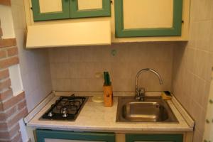 A kitchen or kitchenette at Borgo Di Fonni