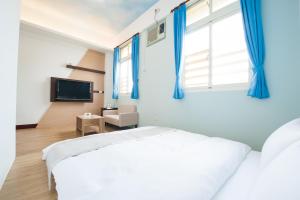 Postel nebo postele na pokoji v ubytování D.C. Inn