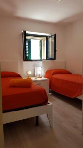 A bed or beds in a room at Salento Case Vela