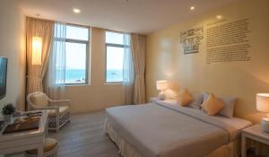 Giường trong phòng chung tại Hotel 19, Penang