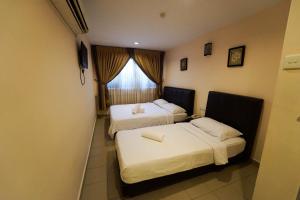 Ένα ή περισσότερα κρεβάτια σε δωμάτιο στο Hotel A-One