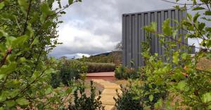 a garden with a walkway in front of a building at Lockleigh Park in Lebrina