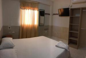Postelja oz. postelje v sobi nastanitve HOTEL NES