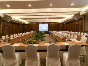 a large meeting room with a long table and chairs at Deevana Plaza Krabi Aonang - SHA Extra Plus in Ao Nang Beach