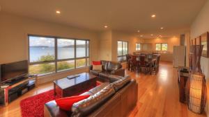 a living room with a couch and a television at Tides Reach in Dover