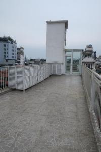 a large balcony with a view of a city at AncyrA TamTam Hotel by Continent - Near Hoan Kiem Lake in Hanoi